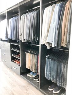 an organized closet with clothes and shoes