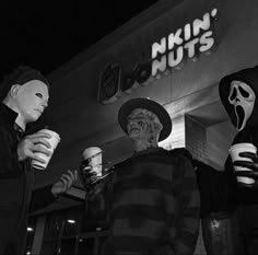 three people dressed up in halloween costumes holding drinks