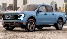 a blue truck parked in front of a city skyline