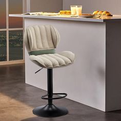 a white bar stool sitting in front of a counter with food on top of it