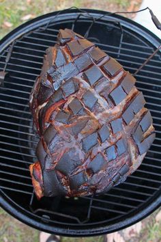 a piece of meat is cooking on the grill