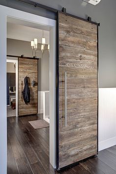 a large wooden door in the middle of a room