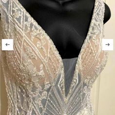 the back of a wedding dress with beading on it