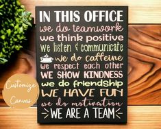 a sign that says in this office we do teamwork