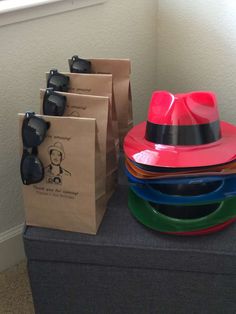 a stack of colorful plates and bags sitting on top of a table