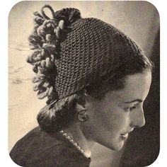 an old photo of a woman wearing a knitted hat