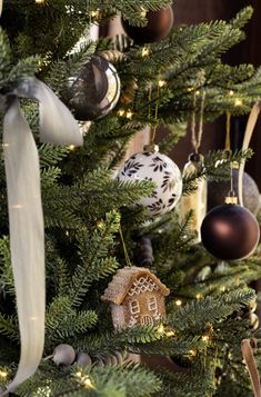 a christmas tree with ornaments hanging from it