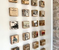 several wooden blocks are arranged on the wall with old photos and pictures attached to them