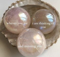 three balls in a shell with the words, wherever you are i am thinking of you and missing you