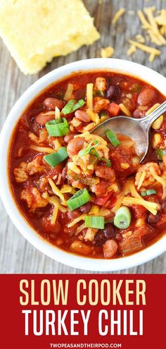 a bowl of slow cooker turkey chili with tortilla chips on the side