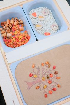 two trays filled with food on top of a table