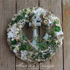 a wreath with an anchor and sea shells