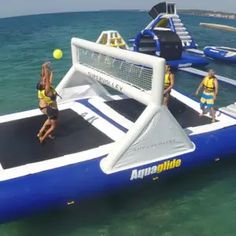 some people are playing volleyball on an inflatable boat