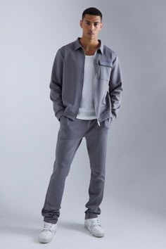 Give your tracksuits a permanent wardrobe residency. Sometimes there’s no stronger look than a full tracksuit and why would you get about in anything less than total comfort? Our men’s tracksuits are designed to give you a multi-purpose look which is both casual & comfortable. Whether it’s black, white, red, grey, skinny fit or regular, we’ve got tracksuits to box your activewear look off. Pair your tracksuits with white sneakers or an oversized t-shirt for a completely clean laid-back look. Style: Harrington TracksuitDesign: PlainFabric: ScubaDetail: Fabric InterestLength: RegularNeckline: Zip ThroughFit: RegularSleeve Length: Long Sleeve Men Fashion Basics, How To Style Joggers Men, Elevated Athleisure Outfits Men, Athleisure For Men, Men Sets Outfit, Elevated Streetwear Men, Winter Gym Outfit Men, Event Outfit Men, Mens Casual Winter Outfits