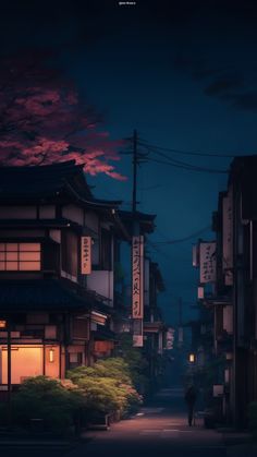 a person walking down a street at night