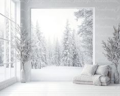 an empty room with a white couch in front of a snowy forest wallpaper mural