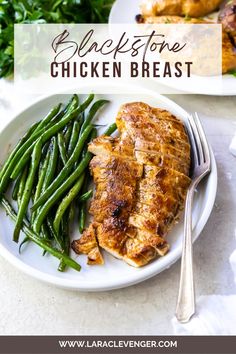 a white plate topped with chicken and green beans next to another plate filled with meat