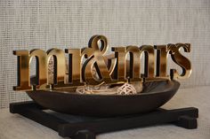 there is a sign that says mr and mrs in gold letters on a black stand