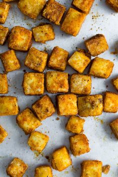 some food that is laying out on a white surface with the words how to make fried tater tots