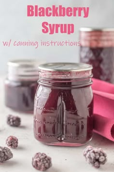 raspberry syrup in a mason jar with the words blackberry syrup w / canning instructions