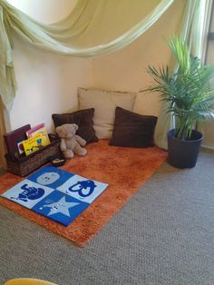 a child's playroom with toys and rugs