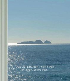 an open window looking out at the ocean and island in the distance with a quote written on it