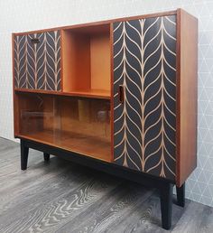 an art deco cabinet is shown against a wall