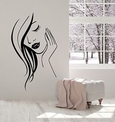 a woman's face with long hair is shown in this wall decal