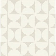 a beige and white wallpaper with circles on it