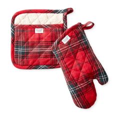 two oven mitts are sitting next to each other on a white background, one is red and the other is green