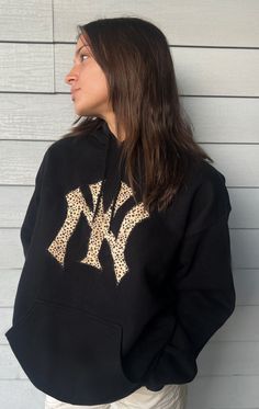 Super comfy black hoodie with NY Yankee Logo! (Can also do other teams & colors DM and ask!) Black Sweatshirt For Game Day In Fall, Black Team Spirit Sweatshirt For Fall, Black Sweatshirt For Game Day Sports Season, Black Sweatshirt For Game Day, Black Long Sleeve Sweatshirt For Game Day, Black Tops With Ribbed Cuffs For Game Day, Black Hoodie With Letter Print For Game Day, Black Hoodie For Game Day In Winter, Black Collegiate Long Sleeve Sweatshirt