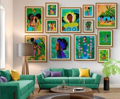 a living room filled with green couches and pictures on the wall above them,