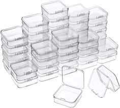 plastic food storage containers with lids and dividers are stacked on top of each other