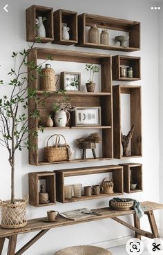 a wooden shelf filled with lots of shelves and baskets on top of it's sides