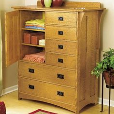 a wooden dresser with drawers in a living room next to a painting on the wall