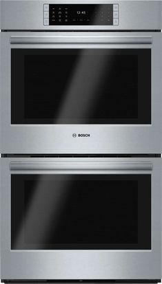 two stainless steel ovens side by side