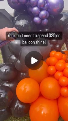 an orange and black balloon sitting on top of a pile of balloons with the caption you don't need to spend $ 25 on balloon shine