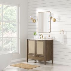 a bathroom with a sink, mirror and bathtub