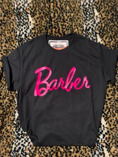 Minimalist Barber Shirt |Hairdresser|Hairstylist| Barbershop | Female Barbers| Barber Girl Shirt |Pink Letters |Dope Shirt |Comfy Shirt|Barber Gear| Woman| Barbie Barber Shirt| Lady Barber shirt  Want Oversize Fit ? Size up :)  Cute Shirt -  All sizes are Unisex  Follow us on Instagram @ rebranded_era Wholesale available  *HTV* Female Barber Outfit, Hairstylist Tshirts, Barber Clothing, Hair Advertising, Hair Stylist Shirts, Barber School, Barber Gifts, Barber Logo, Dope Shirt