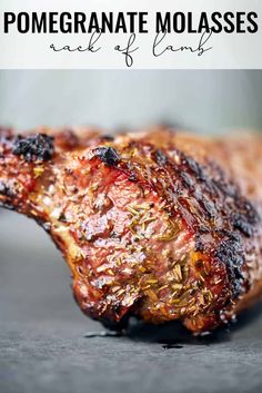 a piece of meat that has been cooked and is sitting on a table with the words pomegranate molasses next to it