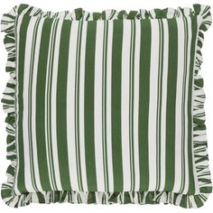 a green and white striped pillow with tassels