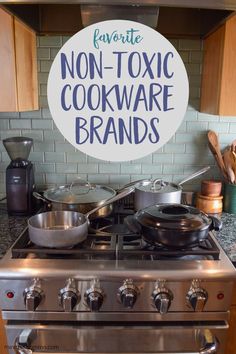 a stainless steel stove top oven sitting under a sign that says non - toxic cookware brands