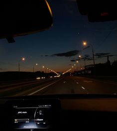 the dashboard of a car at night time