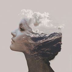 a woman's face with mountains in the background and clouds coming out of her head