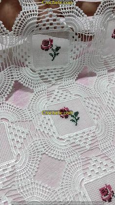 white lace with pink flowers on it