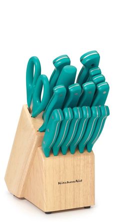 a knife block with many green knives in it