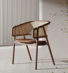 a wooden chair sitting on top of a white floor