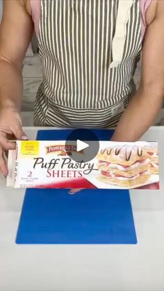 a person cutting up some food on top of a blue cutting board with a knife