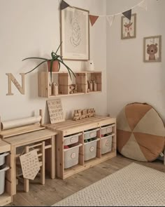 a child's playroom with toys, bookshelves and storage bins