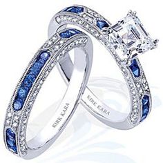 two wedding rings with blue and white stones on the sides, one has a princess cut diamond